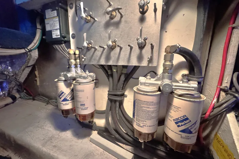  Yacht Photos Pics Engine room of 1989 Bayliner 4588 Pilothouse with Racor fuel filters and control panel.