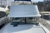 2016 Beneteau Swift Trawler 44 docked, showcasing its sleek design and spacious deck.