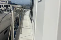 2016 Beneteau Swift Trawler 44 docked, side view with clear sky.