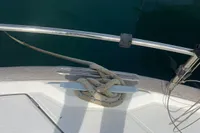 2016 Beneteau Swift Trawler 44 deck with cleat and rope, near water.