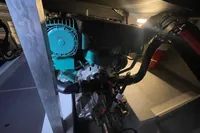 Engine compartment of 2016 Beneteau Swift Trawler 44, showcasing mechanical components and wiring.
