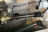 Engine compartment of a 2016 Beneteau Swift Trawler 44, showing mechanical components and hoses.
