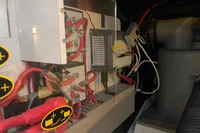 Engine room of 2016 Beneteau Swift Trawler 44 with electrical components and wiring.
