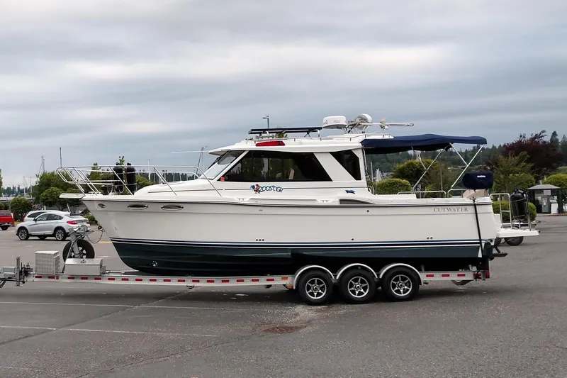 Free Range Yacht Photos Pics 2016 Cutwater C-28 LE boat on trailer in parking lot, overcast sky.