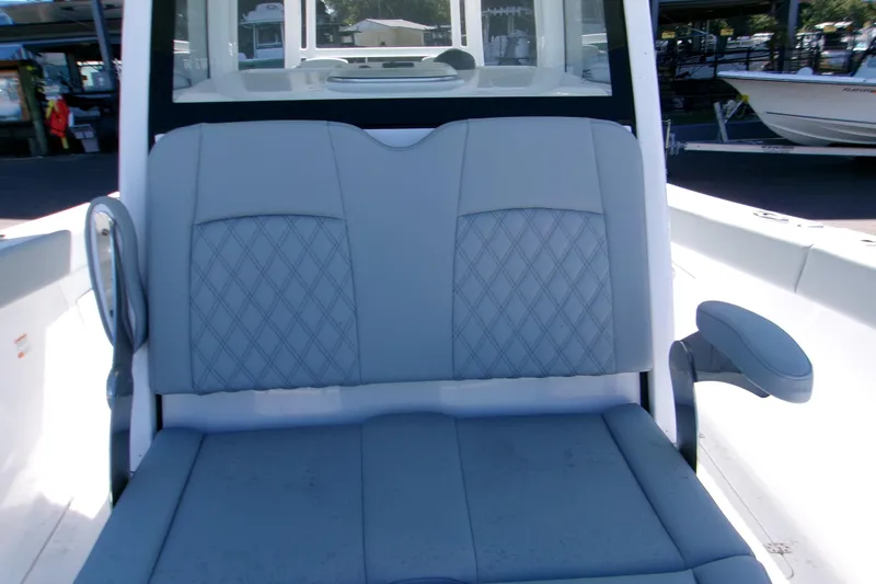  Yacht Photos Pics 2026 Sportsman Heritage 321 Center Console boat seat with diamond-pattern upholstery.