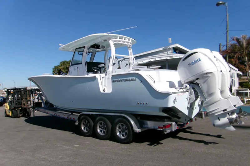  Yacht Photos Pics 2026 Sportsman Heritage 321 Center Console boat on trailer, featuring dual outboard engines.