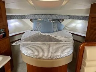 Pathological Yacht Photos Pics Interior of 2000 Pursuit 3400 Express with cozy bed.