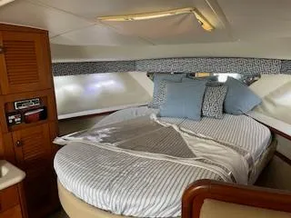 Pathological Yacht Photos Pics Interior of a 2000 Pursuit 3400 Express yacht with cozy bed.