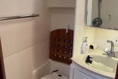 Pathological Yacht Photos Pics Bathroom in Pursuit 3400 Express boat, year 2000.