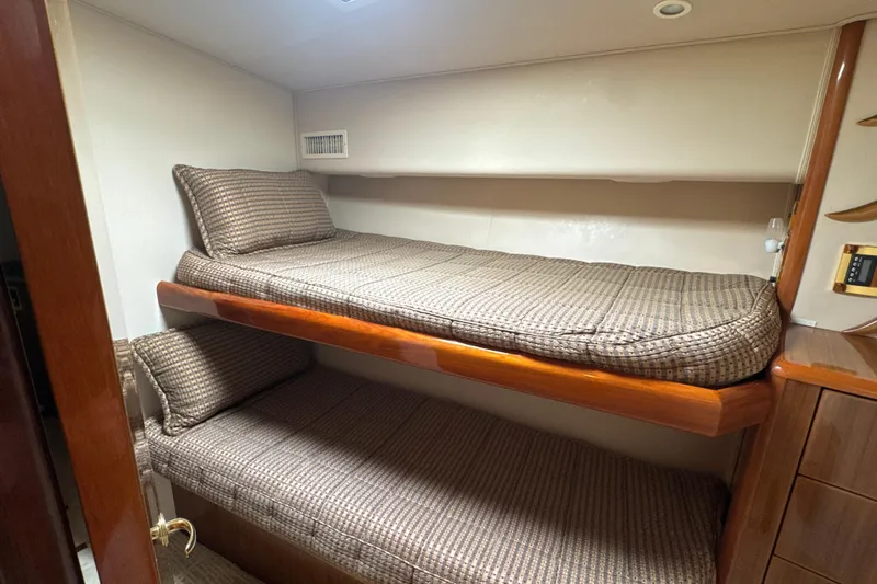On The Ball Yacht Photos Pics Bunk beds in 2006 Viking 56 Convertible yacht cabin with patterned bedding.