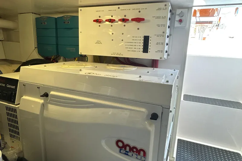 On The Ball Yacht Photos Pics Engine room of 2006 Viking 56 Convertible with Onan generator and control panel.