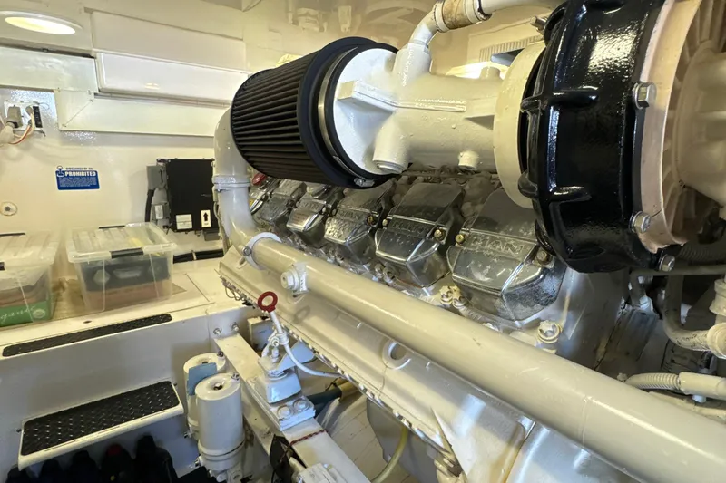On The Ball Yacht Photos Pics Engine room of a 2006 Viking 56 Convertible yacht, showcasing a powerful marine engine.