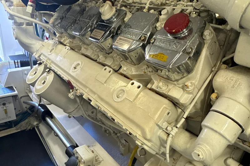 On The Ball Yacht Photos Pics Engine room of a 2006 Viking 56 Convertible yacht, showcasing a powerful marine engine.