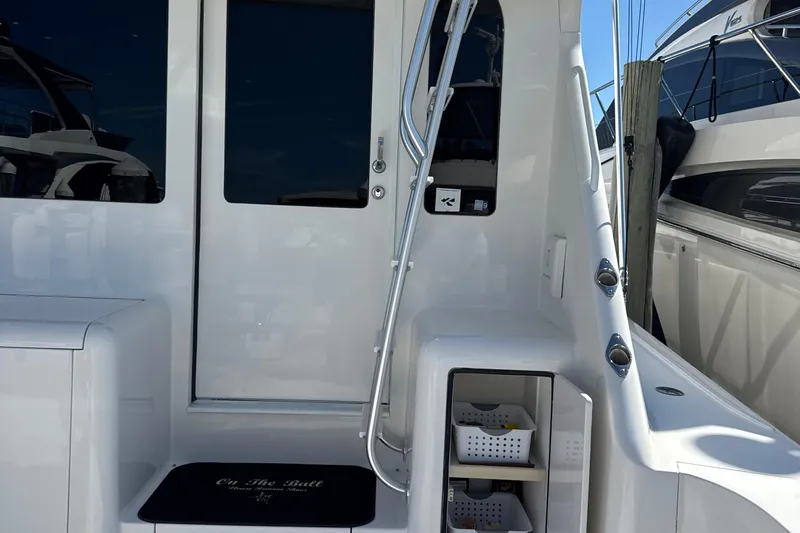 On The Ball Yacht Photos Pics 2006 Viking 56 Convertible yacht interior with storage and sleek design.