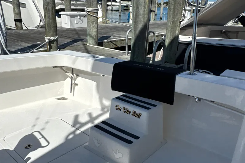 On The Ball Yacht Photos Pics 2006 Viking 56 Convertible yacht docked, featuring a clean white deck and step details.