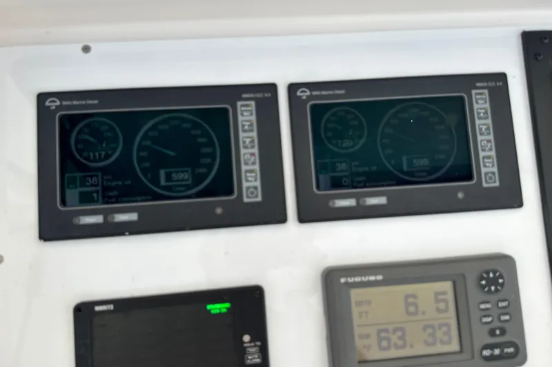 On The Ball Yacht Photos Pics Control panel of a 2006 Viking 56 Convertible yacht with digital displays.