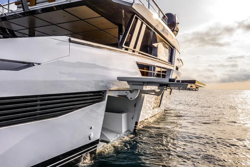 Mabelle Yacht Photos Pics 2022 Arcadia Yachts Sherpa 80 XL cruising on the ocean at sunset.