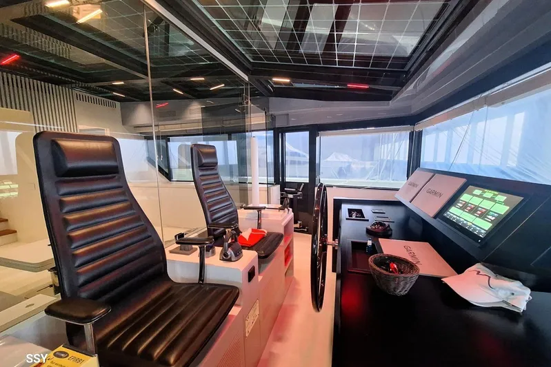 Mabelle Yacht Photos Pics Modern helm station of 2022 Arcadia Yachts Sherpa 80 XL with advanced navigation systems.