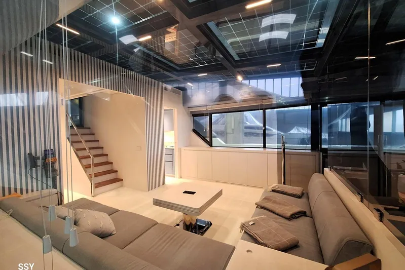 Mabelle Yacht Photos Pics Luxurious interior of 2022 Arcadia Yachts Sherpa 80 XL with modern design and spacious seating.