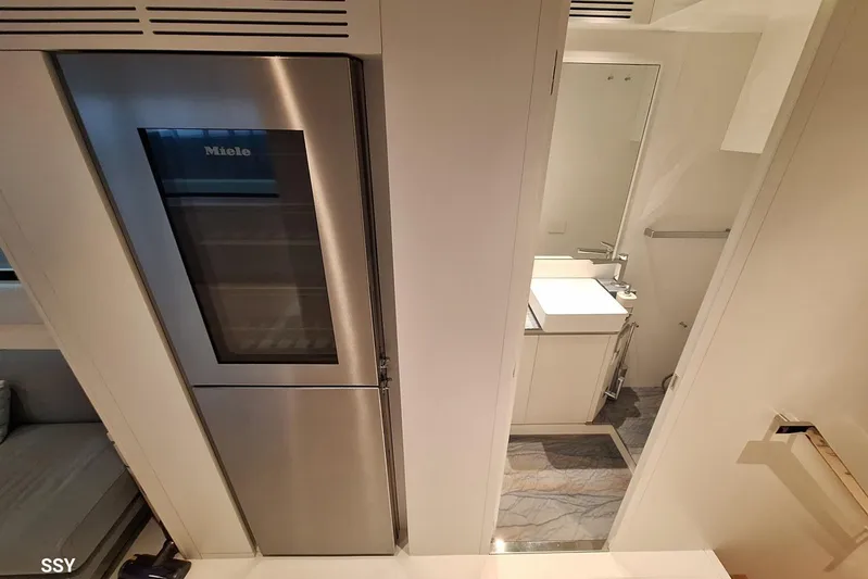 Mabelle Yacht Photos Pics Modern interior of 2022 Arcadia Yachts Sherpa 80 XL with sleek kitchen and bathroom design.