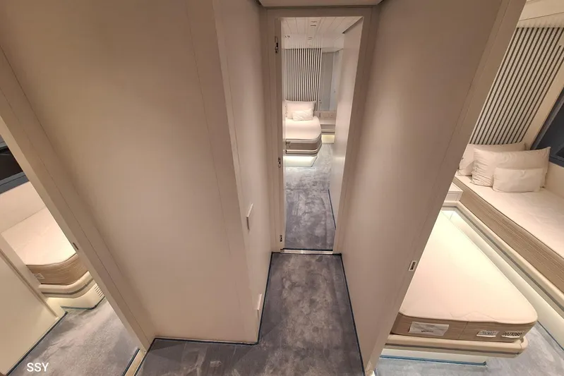 Mabelle Yacht Photos Pics Luxurious interior of 2022 Arcadia Yachts Sherpa 80 XL, featuring elegant bedrooms and modern design.