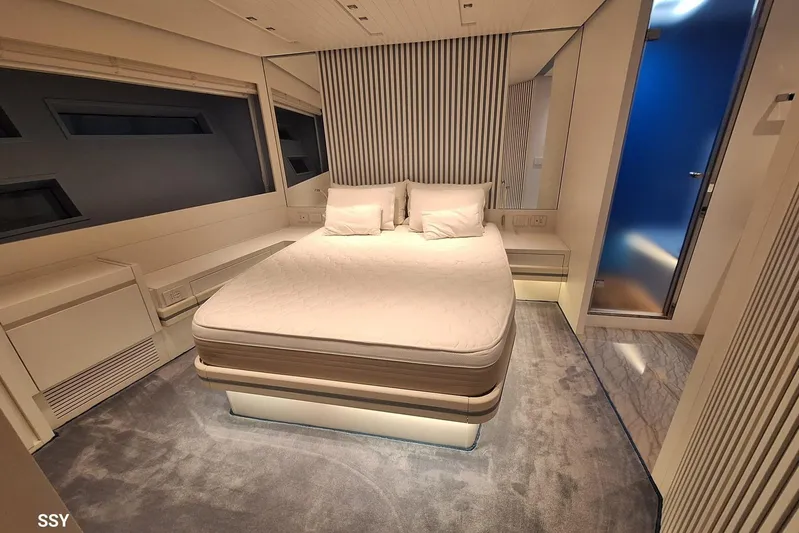 Mabelle Yacht Photos Pics Luxurious bedroom interior of 2022 Arcadia Yachts Sherpa 80 XL with modern design.