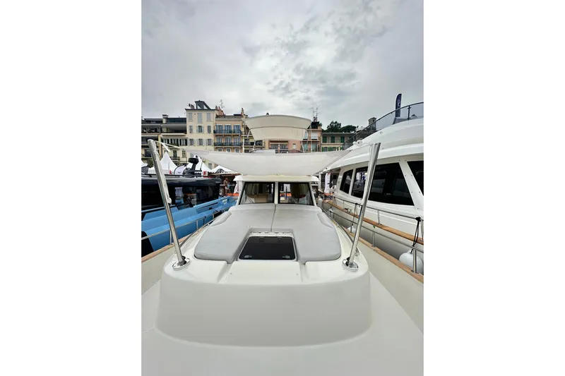  Yacht Photos Pics 2026 Sasga Yachts Menorquin 48FB docked, showcasing sleek design and spacious deck.