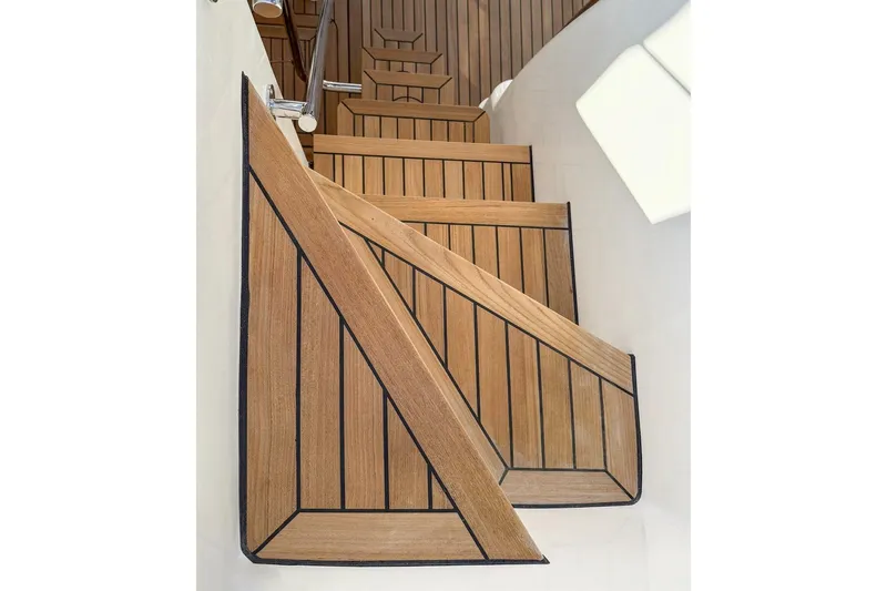  Yacht Photos Pics Teak wood stairs on 2026 Sasga Yachts Menorquin 48FB, elegant marine design.