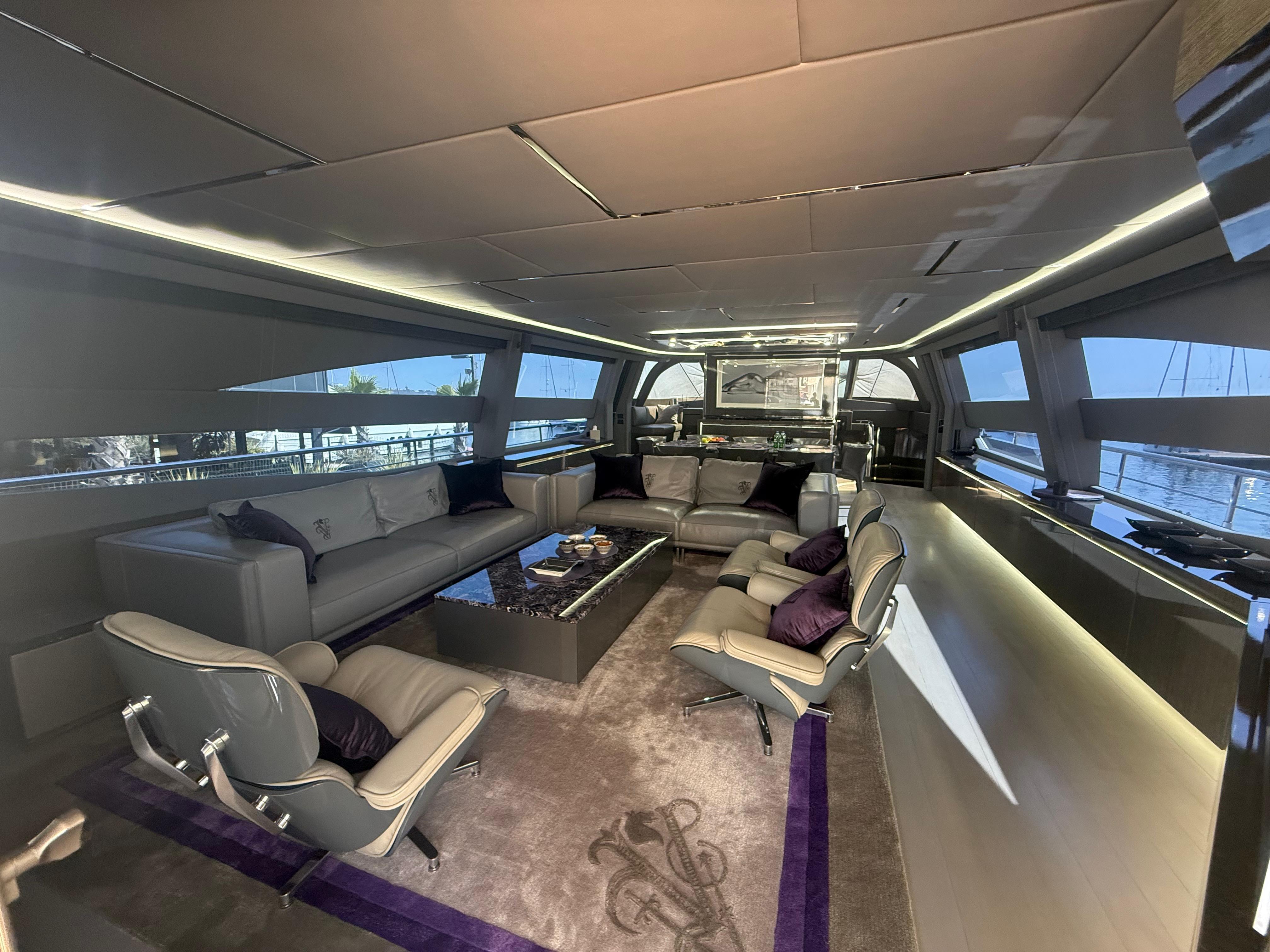 Luxurious interior of 2017 AB 100 yacht with modern seating and elegant decor.