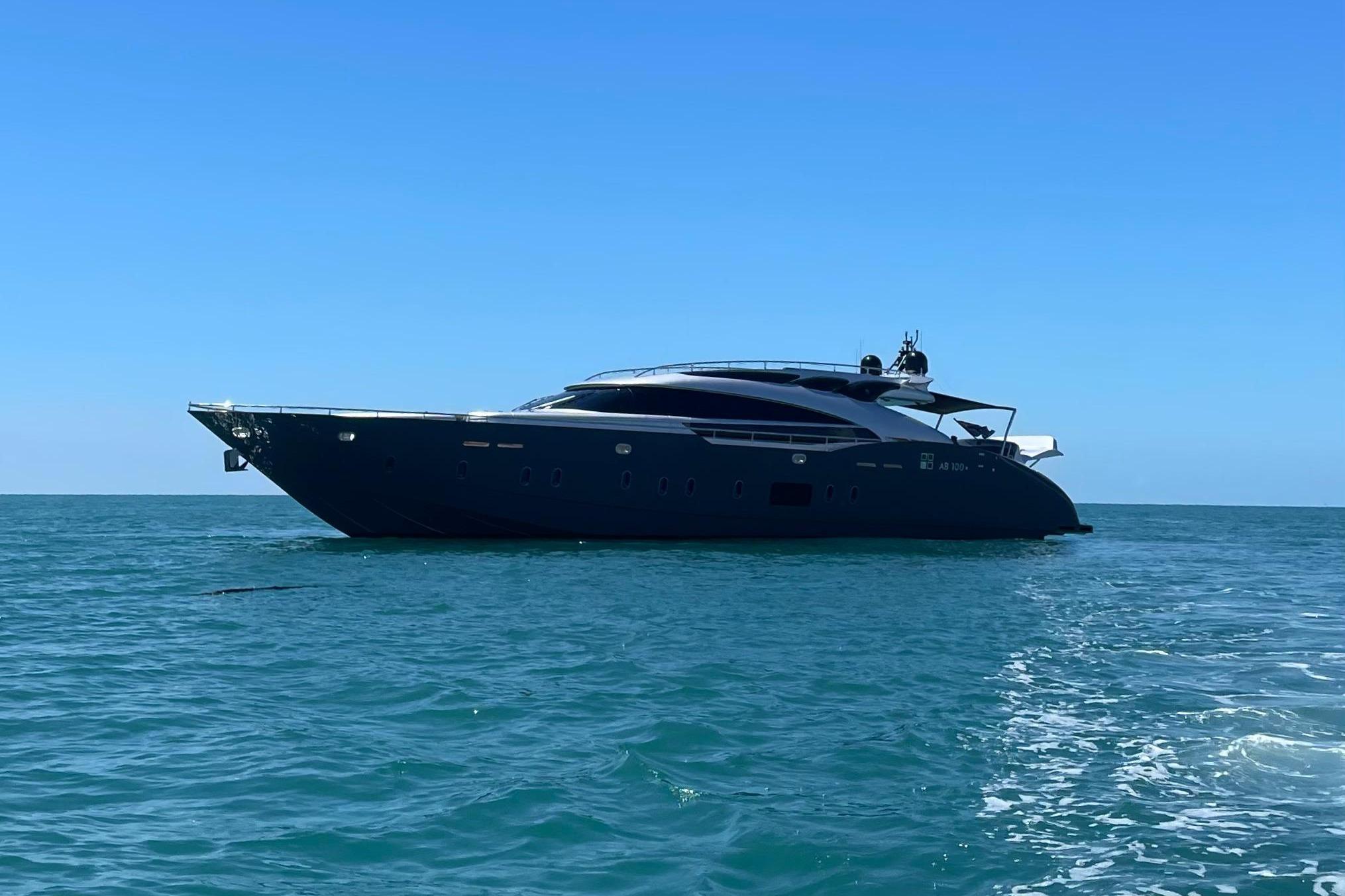 Luxurious AB 100 yacht from 2017 cruising on clear blue ocean waters.