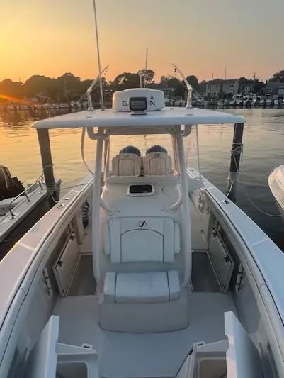 Yacht Photos Pics 2018 Jupiter 29 HFS boat at sunset, docked in a serene marina setting.