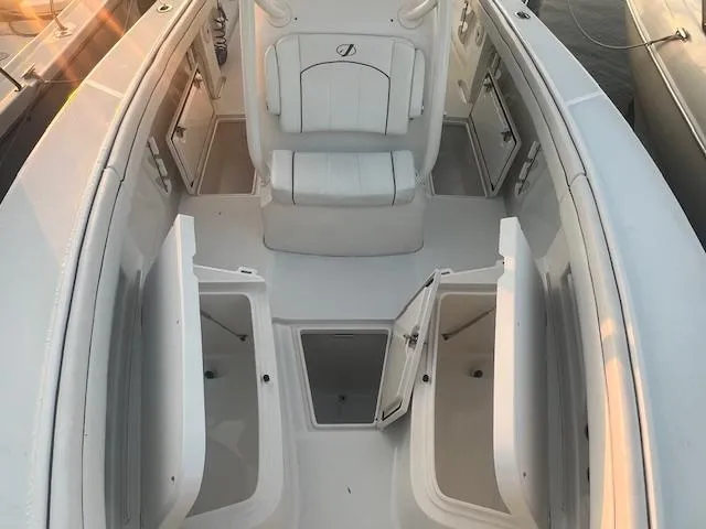  Yacht Photos Pics 2018 Jupiter 29 HFS boat interior with open storage compartments and seating.