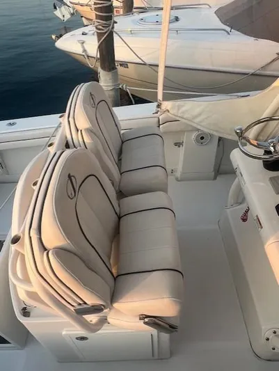  Yacht Photos Pics 2018 Jupiter 29 HFS boat with white cushioned seats docked at marina.