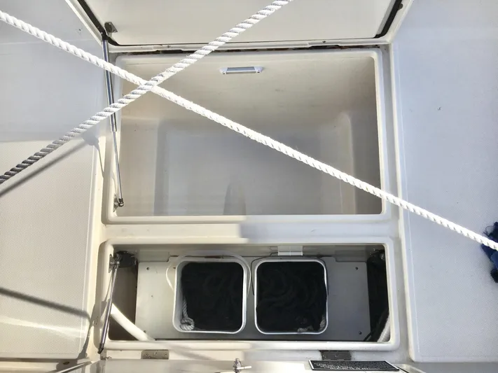  Yacht Photos Pics Open storage compartment on a 2018 Jupiter 29 HFS boat deck.