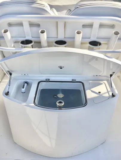  Yacht Photos Pics 2018 Jupiter 29 HFS boat with open storage compartment and rod holders.