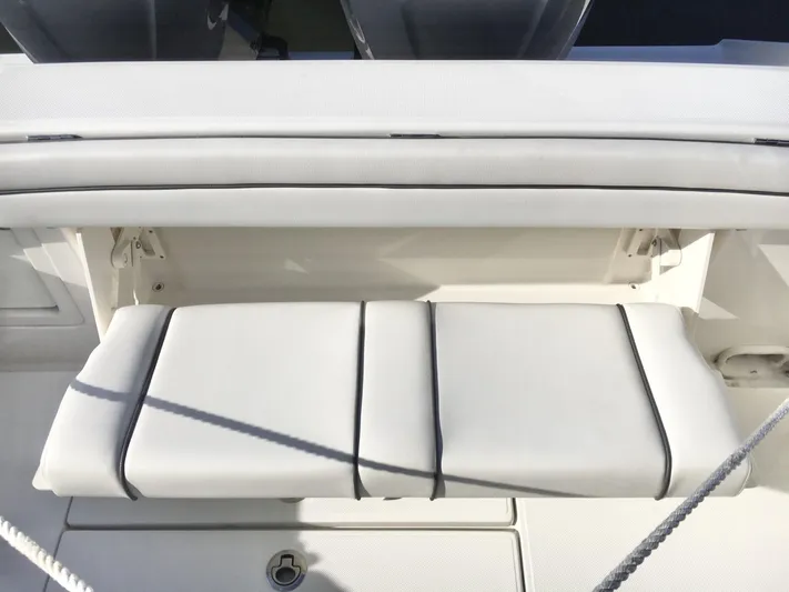 Yacht Photos Pics 2018 Jupiter 29 HFS boat seat with white cushioned upholstery.