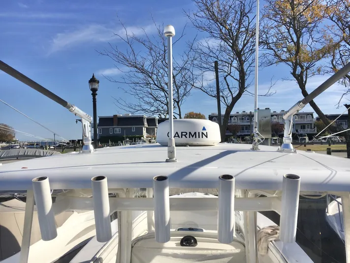  Yacht Photos Pics 2018 Jupiter 29 HFS boat with Garmin equipment, docked near waterfront homes.