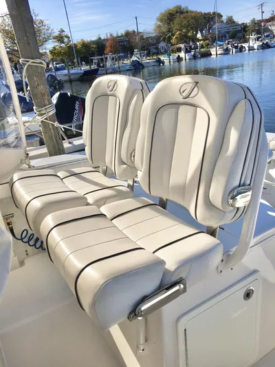  Yacht Photos Pics 2018 Jupiter 29 HFS boat with white cushioned seats by the marina.