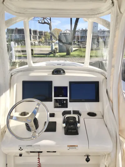  Yacht Photos Pics 2018 Jupiter 29 HFS boat helm with dual screens and steering wheel.