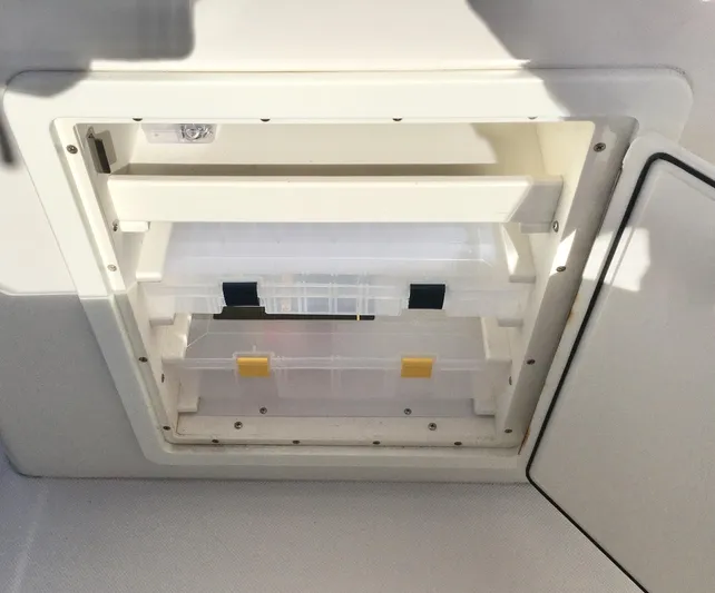  Yacht Photos Pics 2018 Jupiter 29 HFS storage compartment with organized tackle boxes.