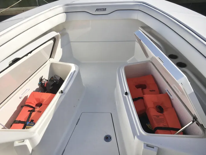  Yacht Photos Pics 2018 Jupiter 29 HFS boat with open storage compartments and life jackets.