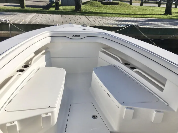  Yacht Photos Pics 2018 Jupiter 29 HFS boat interior with white seating and storage compartments.