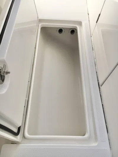  Yacht Photos Pics 2018 Jupiter 29 HFS boat storage compartment, open and empty, with white interior.