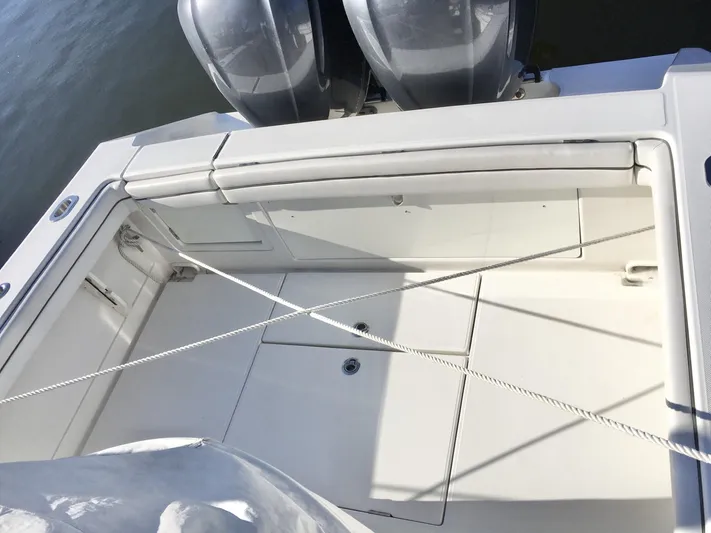  Yacht Photos Pics 2018 Jupiter 29 HFS boat deck with twin engines and seating area.