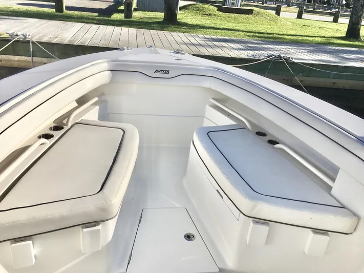  Yacht Photos Pics 2018 Jupiter 29 HFS boat interior with cushioned seating and sleek design.