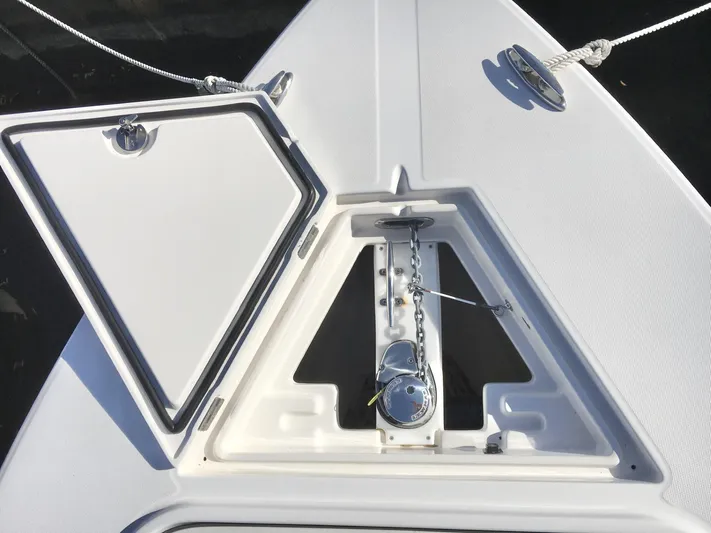  Yacht Photos Pics 2018 Jupiter 29 HFS boat anchor compartment with open hatch and chain mechanism.