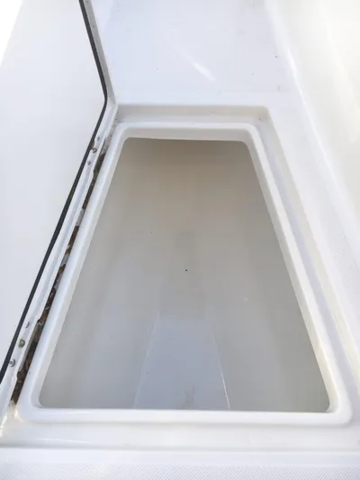  Yacht Photos Pics Storage compartment on a 2018 Jupiter 29 HFS boat, open and empty.