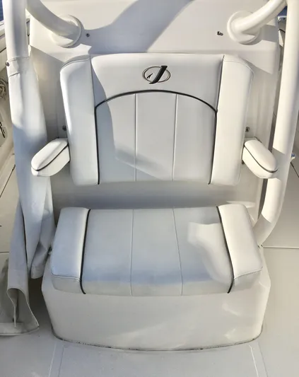  Yacht Photos Pics 2018 Jupiter 29 HFS boat seat with white upholstery and armrests.