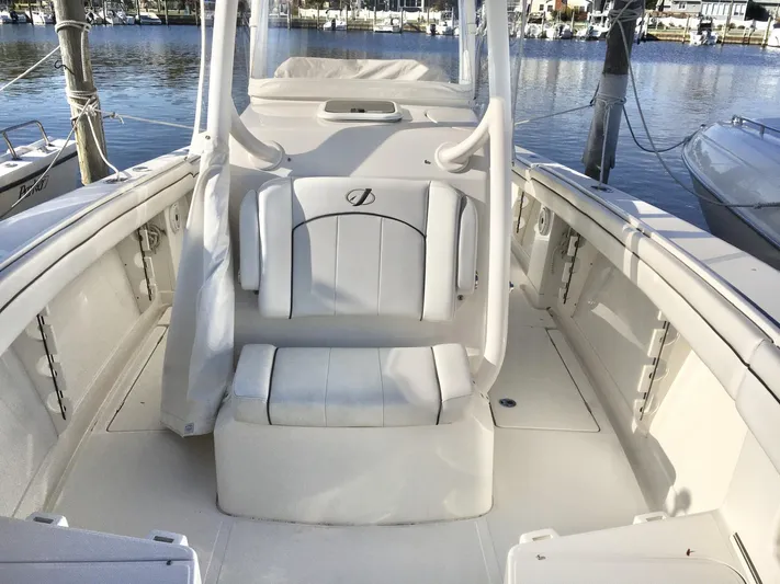  Yacht Photos Pics 2018 Jupiter 29 HFS boat interior with seating, docked at marina.