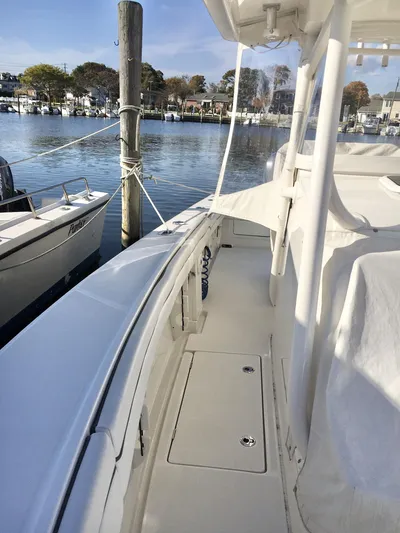  Yacht Photos Pics 2018 Jupiter 29 HFS boat docked in a serene marina setting.